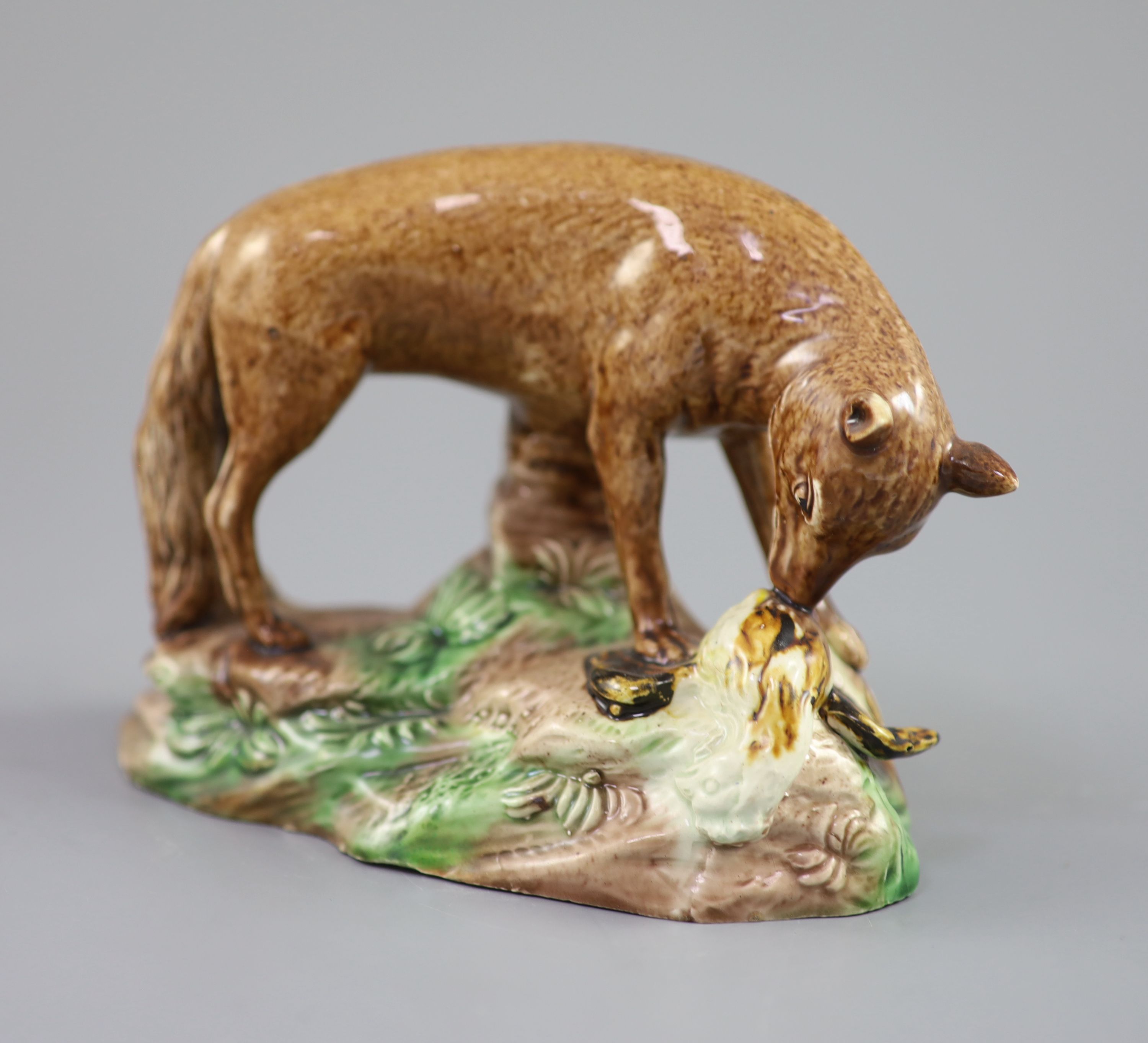 A Ralph Wood the Younger polychrome pottery figure of a fox with rooster, c.1780, 16.5cm long